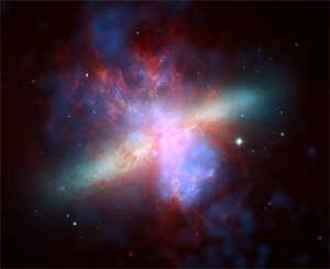M32: Three of NASA's great observatories joined forces to create this rainbow of a galaxy. This image was made using infrared light from Spitzer, visible light from the Hubble Space Telescope, and X-rays from the Chandra X-ray Observatory.