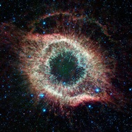 Helix Nebula: The Helix Nebula always seems to be looking back at us. It is the leftover cloud of debris from the death of a star like our Sun.
